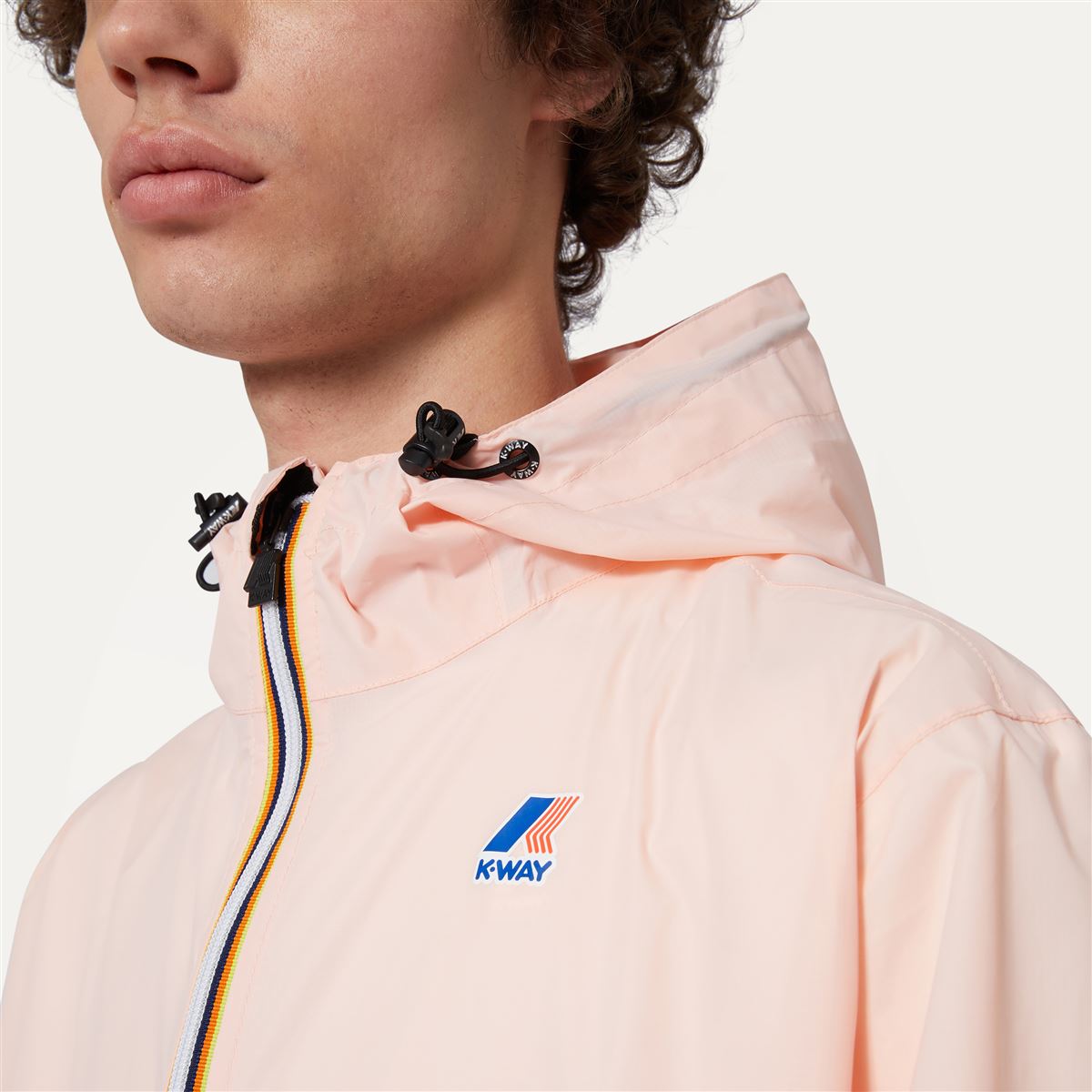 Claude - Veste de pluie imperméable pliable à fermeture éclair intégrale unisexe en rose Dafne