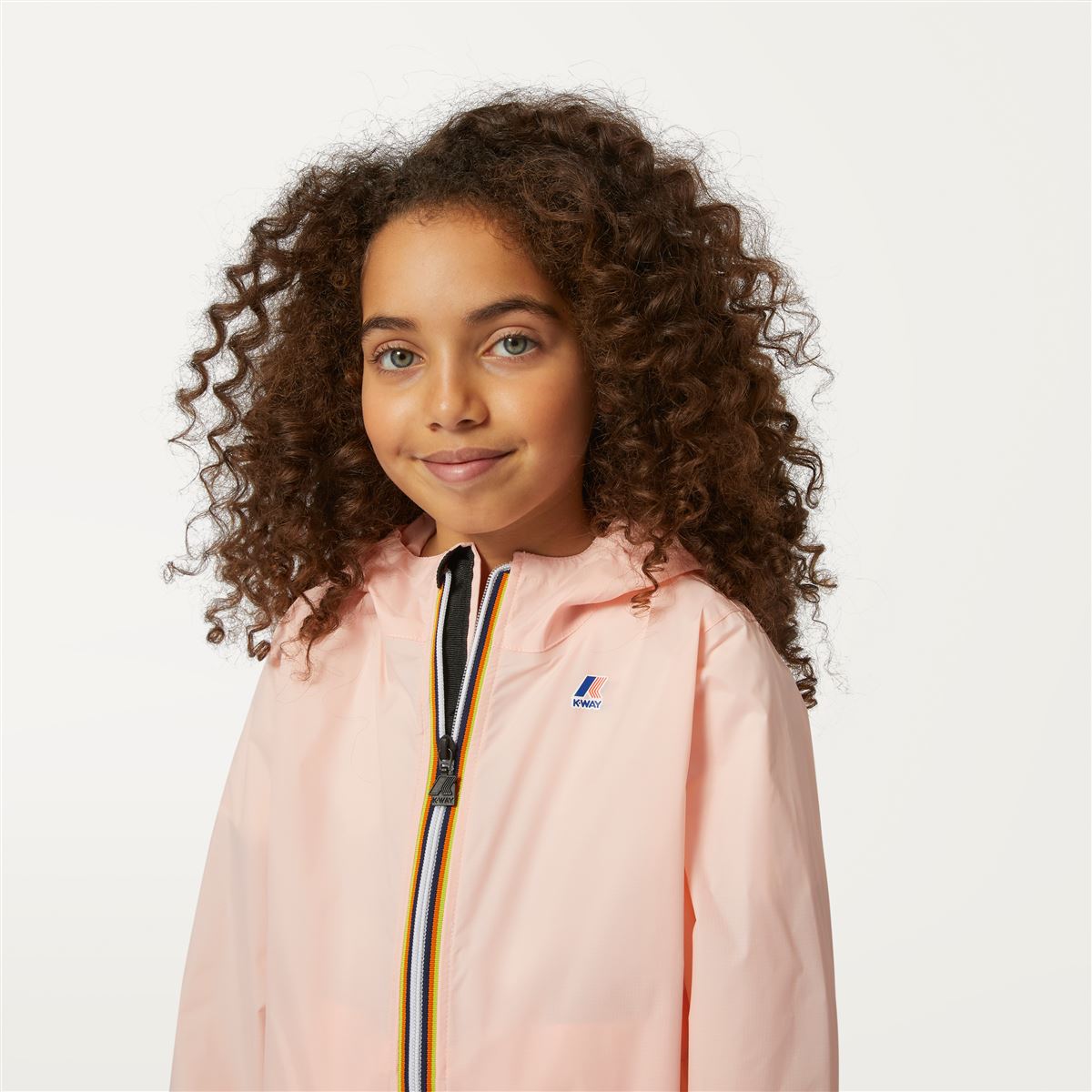 Claude - Veste de pluie imperméable et repliable pour enfants en rose Dafne
