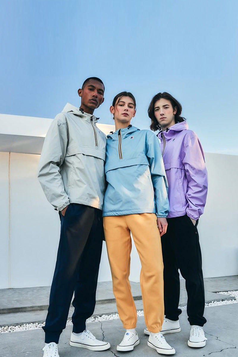K-Way Teens (1 women and 2 men) wearing Kiwi Leon Jackets in Pastel colors.
